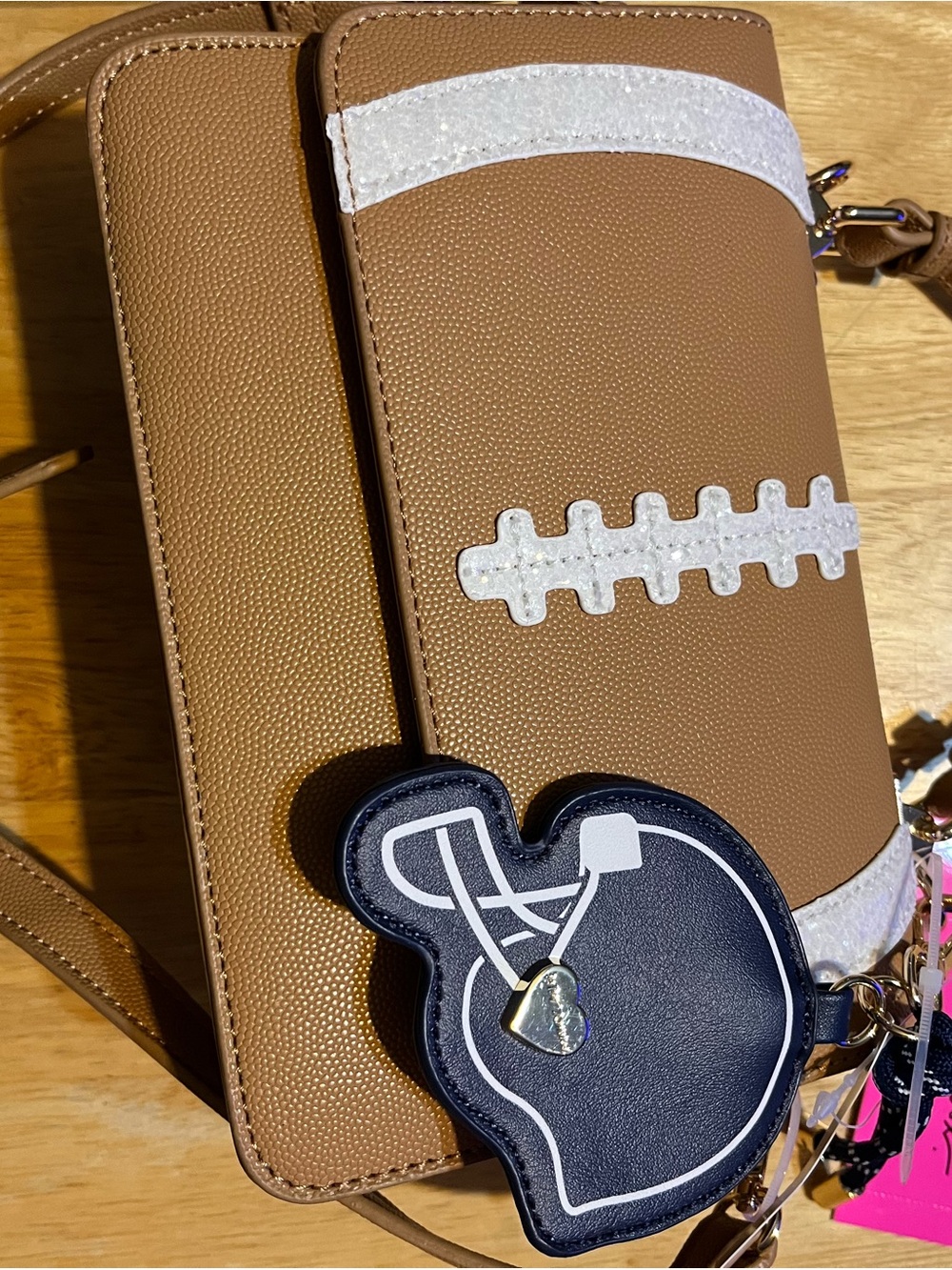 Betsey Johnson Brown Crossbody Bag with White Football Accent and Navy Charm